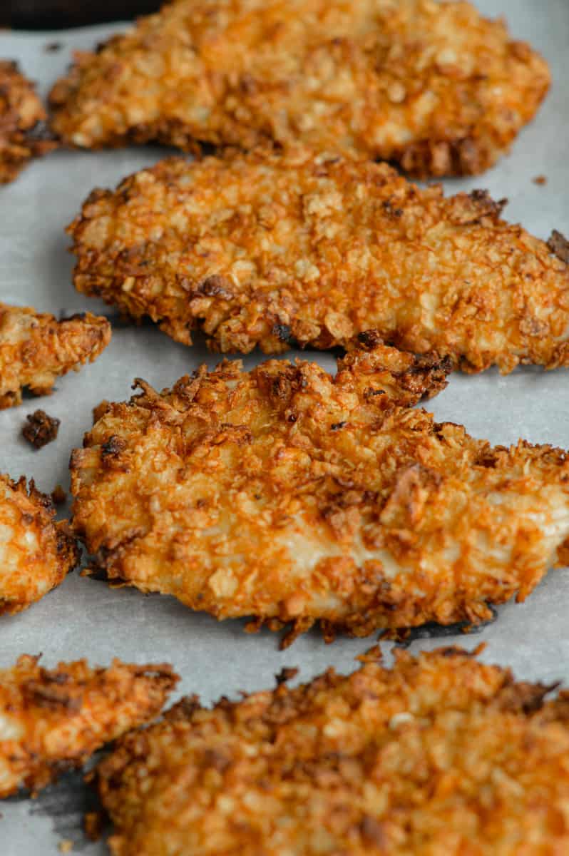 Crispy air fryer chicken tenders on a tray.