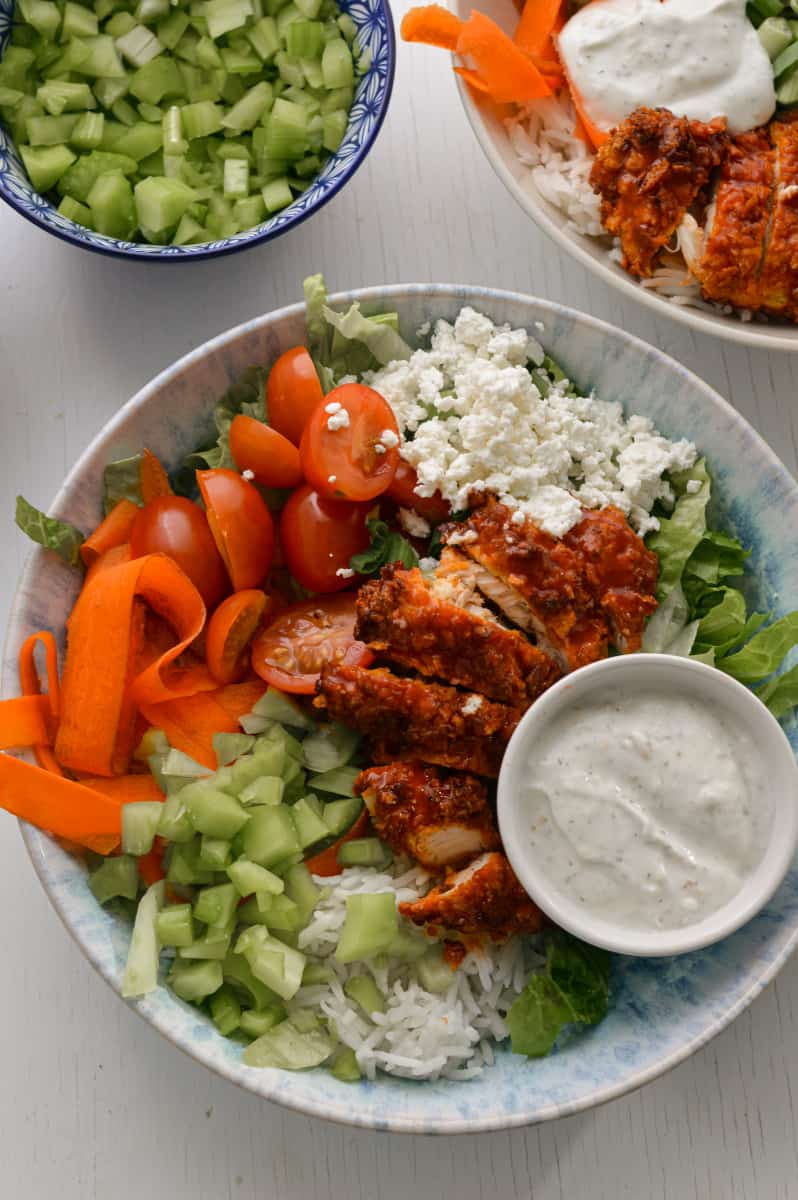 Buffalo chicken rice bowls served with ranch.