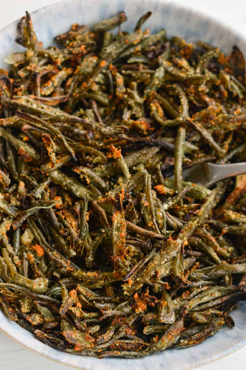 Air fry frozen green beans in a bowl.