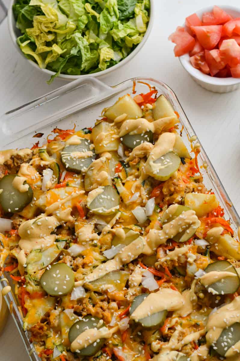 Drizzling big mac sauce on casserole.