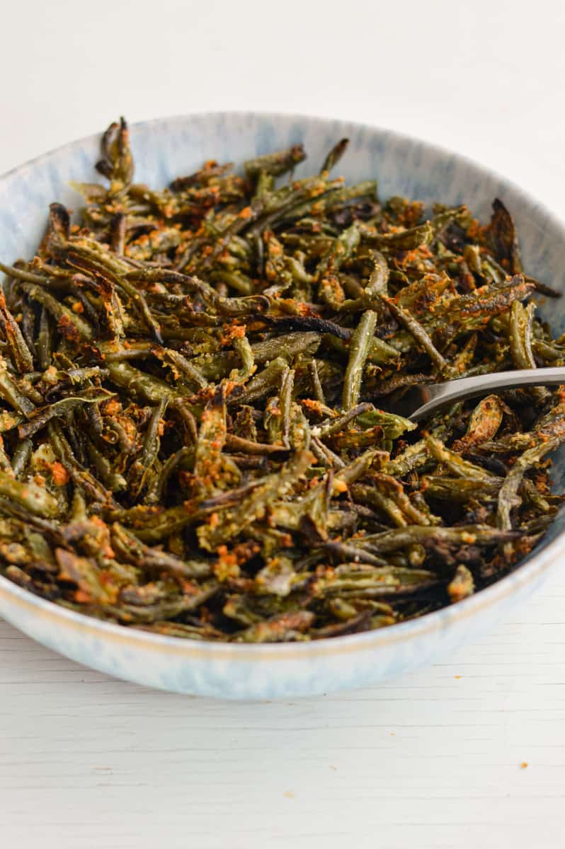 Bowl of cheesy roasted green beans.