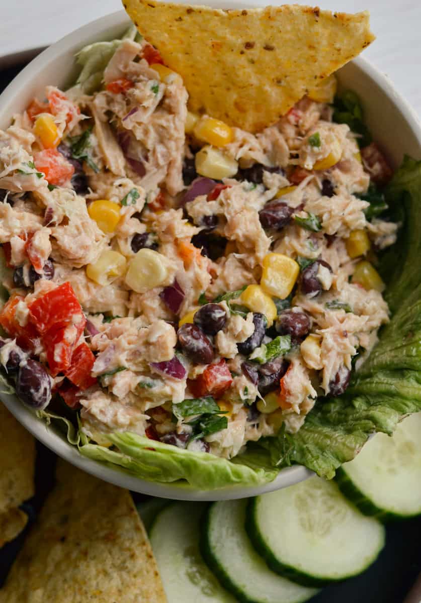 Mexican tuna salad served with chips and cucumbers.