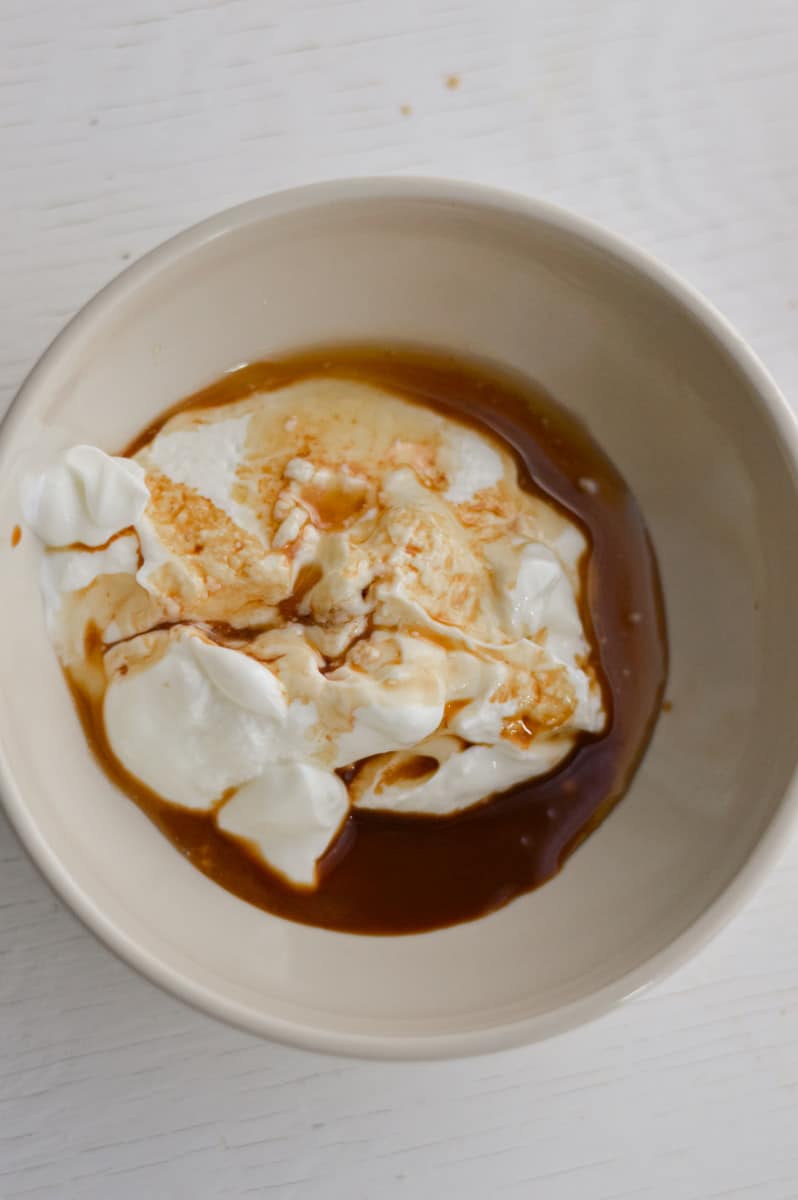 Mixing creamy topping in a bowl.