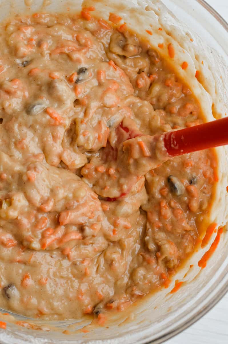 Stirring banana and carrot muffin batter.