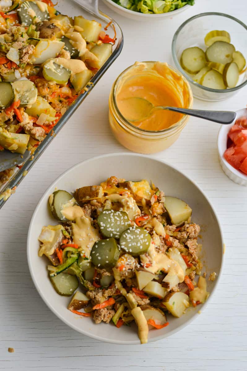 Serving big mac sauce on casserole.