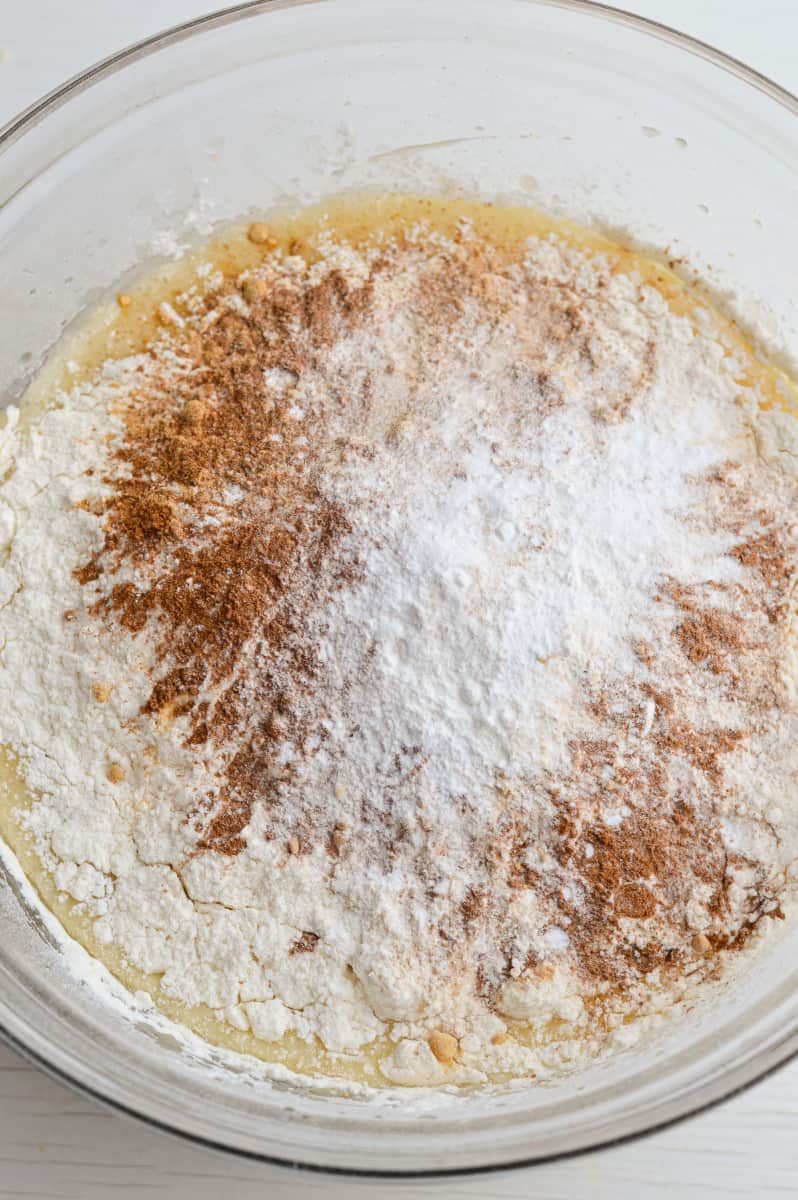 Sifting flour into batter.
