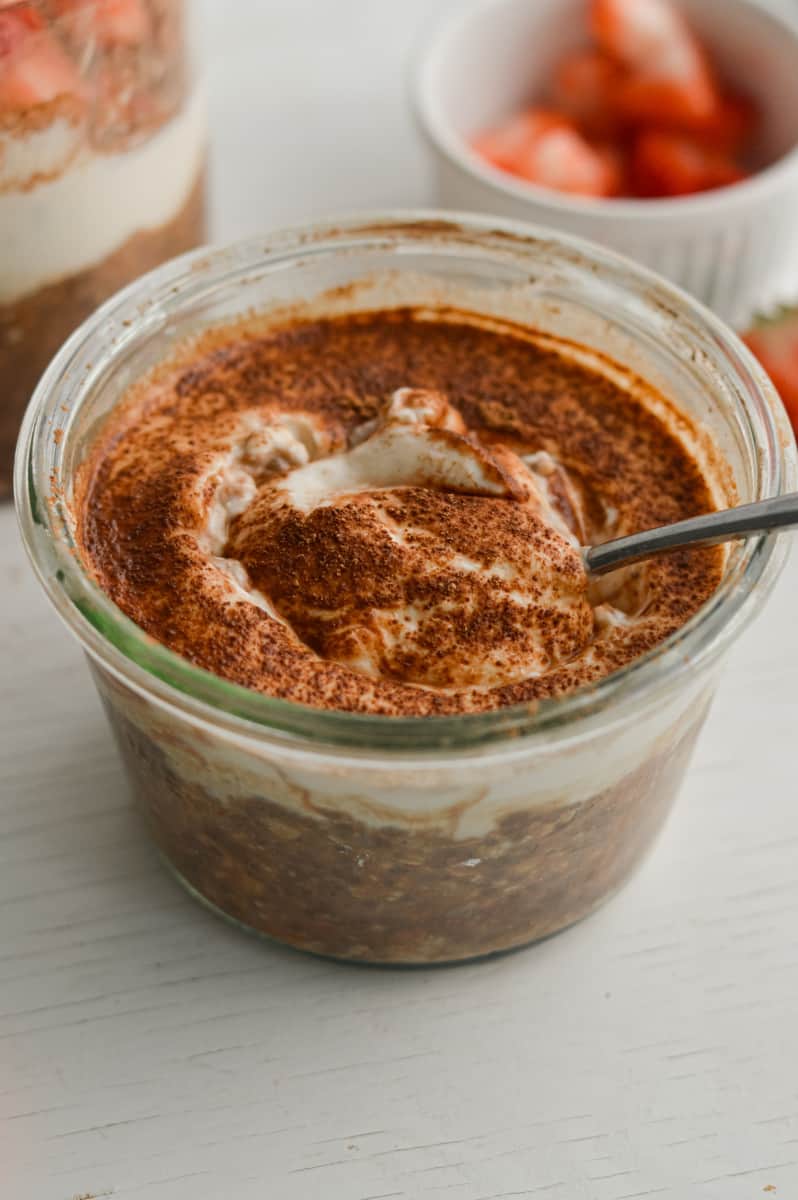 Tiramisu overnight oats with a spoon.