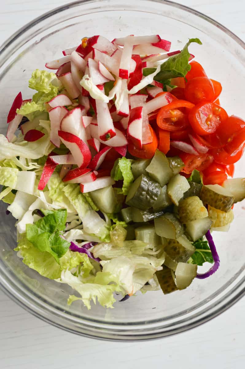 Mixing veggies for wrap filling.