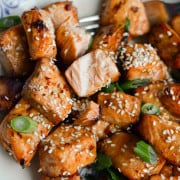 Close up of air fryer teriyaki salmon bites.