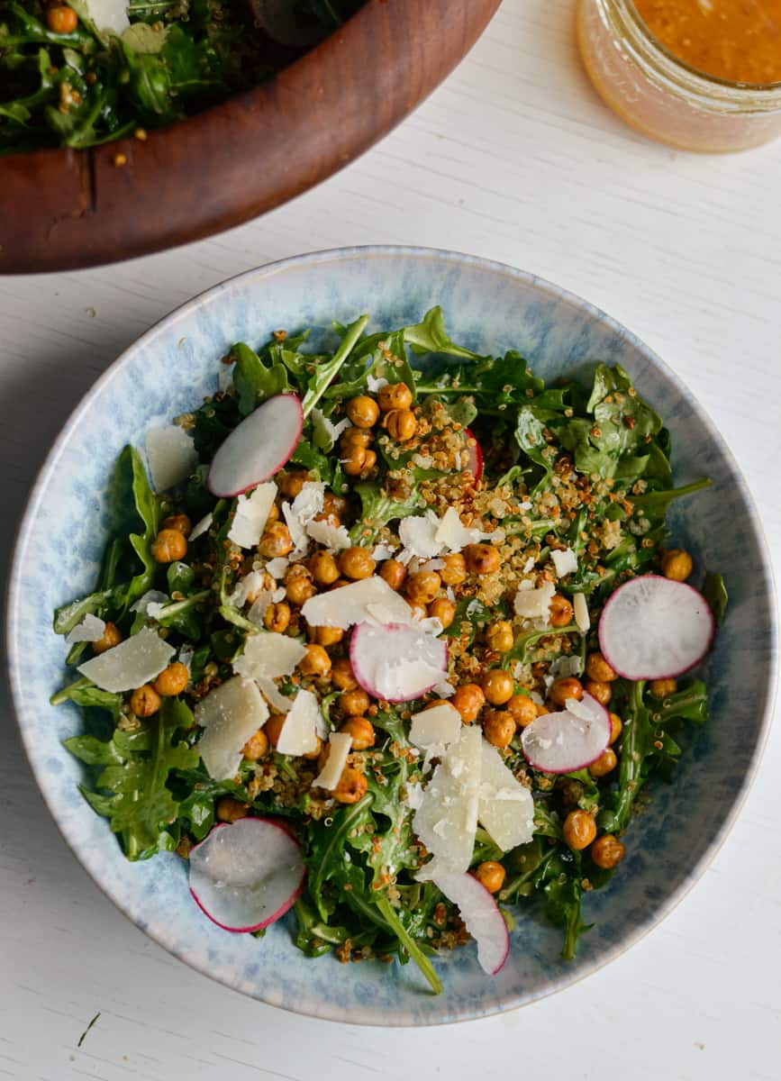 Arugula quinoa salad dressed with lemon caesar vinaigrette
