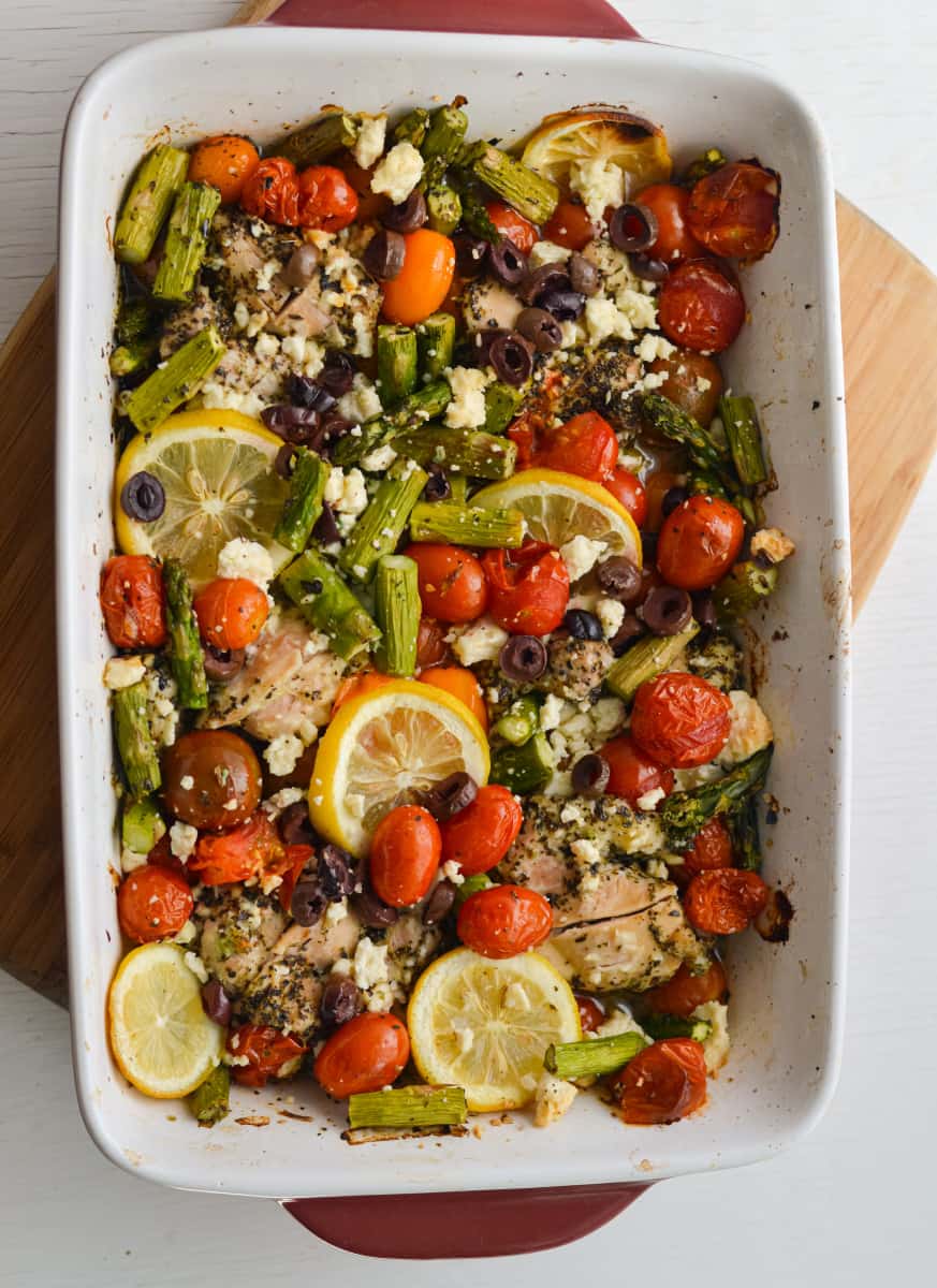 Feta chicken bake topped with lemon slices.