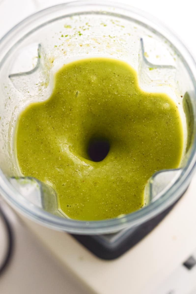 Blending together green smoothie.
