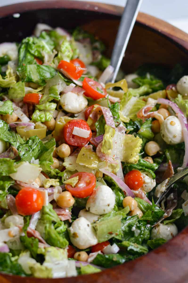 Tossing a bowl of grinder salad.