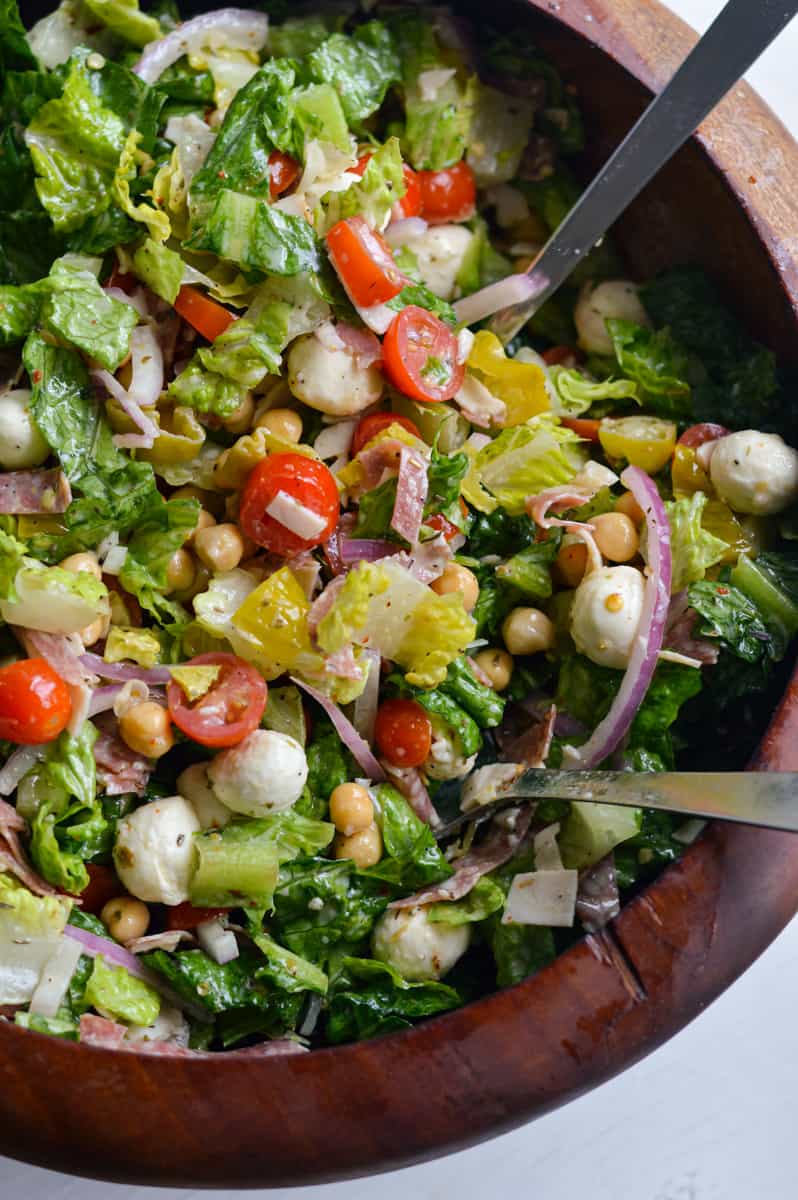 Mixing grinder salad.