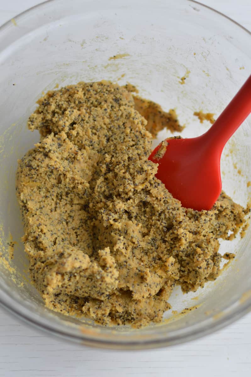 Mixing energy ball dough with a spatula.