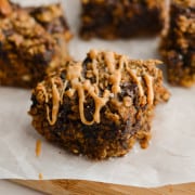 Close up of peanut butter oatmeal bars drizzled with peanut butter.