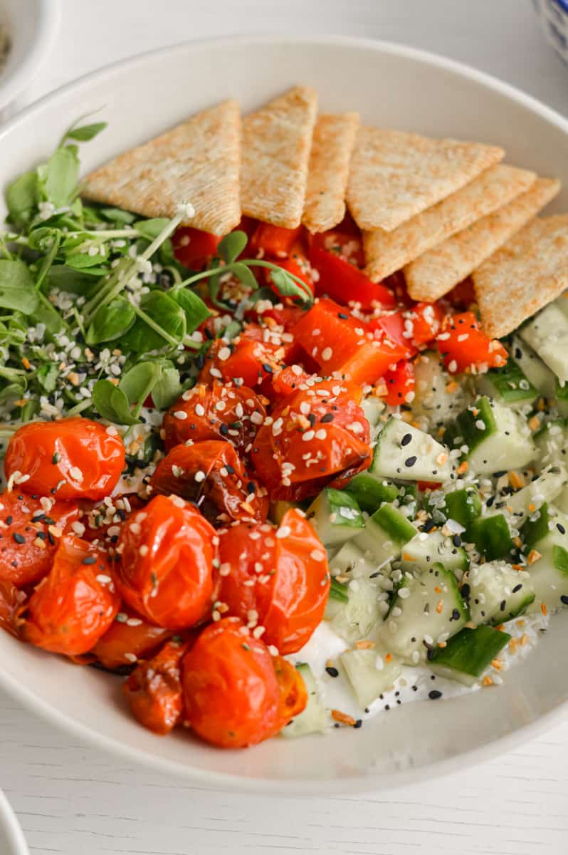 Savoury cottage cheese bowl with crackers and veggies.