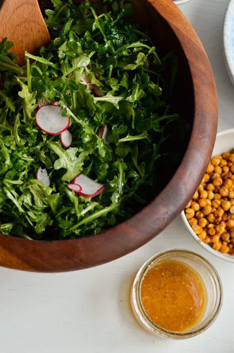Tossing together salad ingredients.