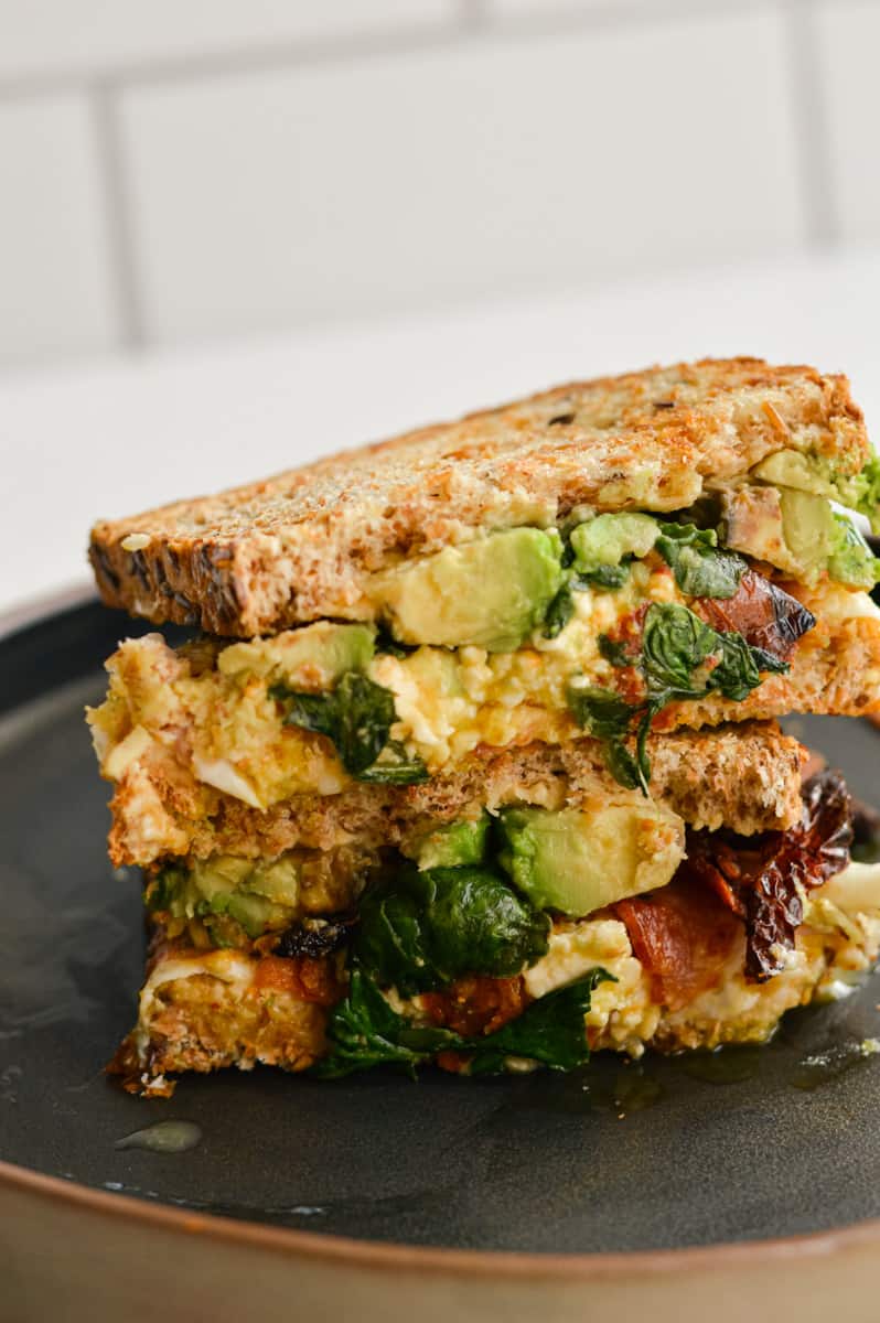 Air fryer breakfast sandwich cut in half and stacked.
