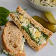 egg salad with pickles in a sandwich