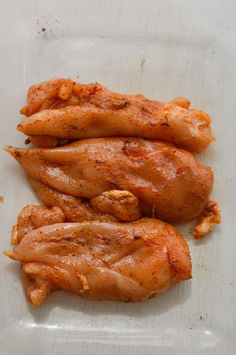 Marinating chicken breast to bake.