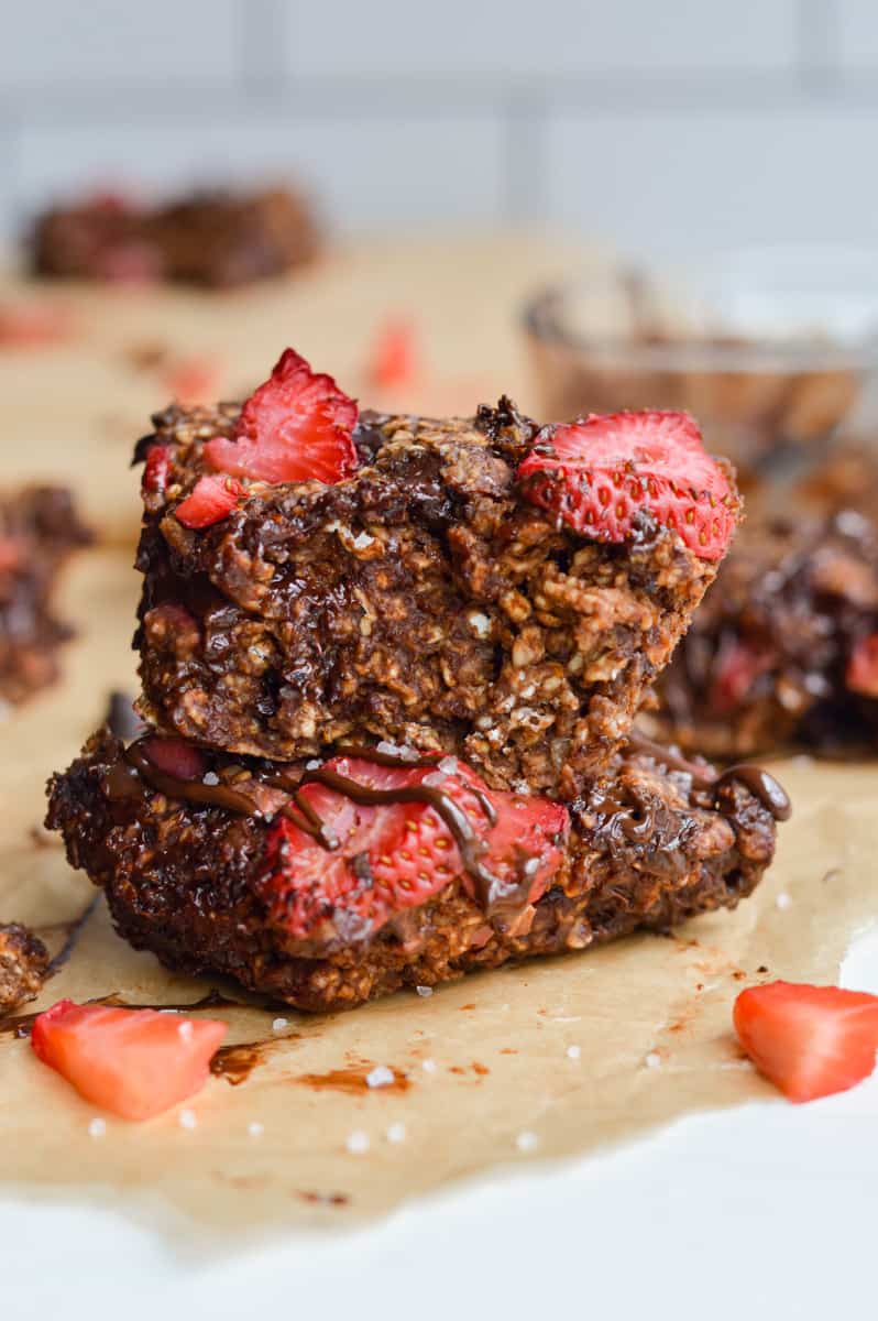 Two slices of strawberry chocolate baked oats stacked.