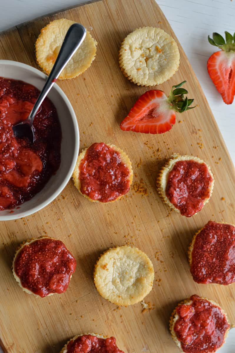 Topping mini protein cheesecakes with chia jam.