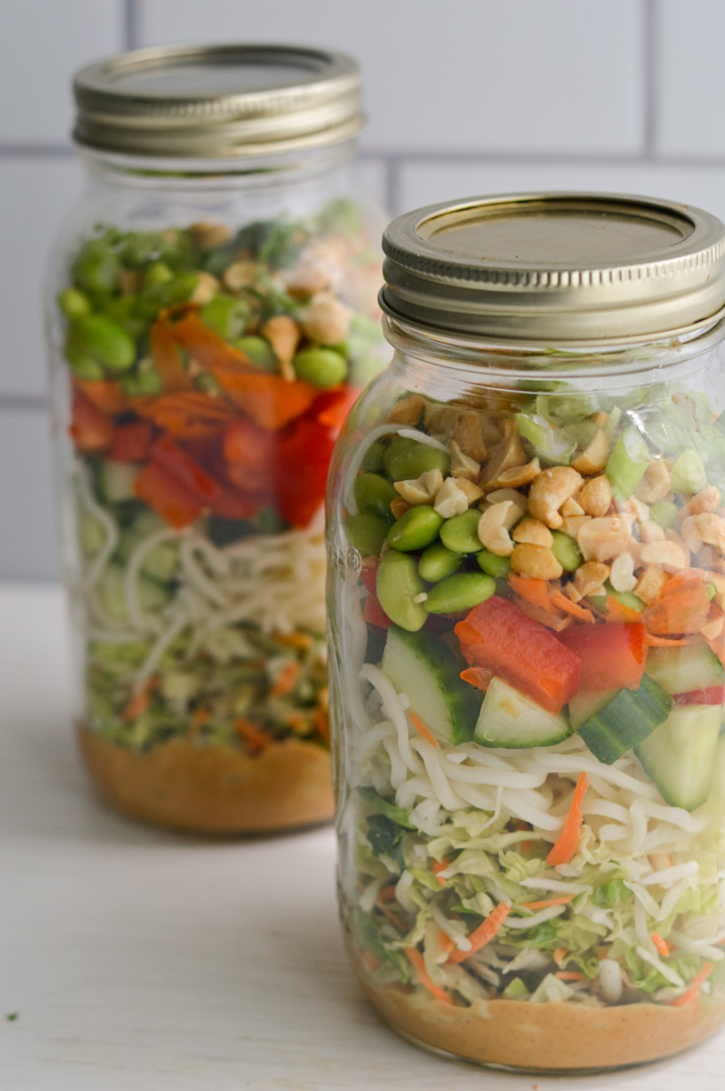 Two jars of mason jar peanut salad.