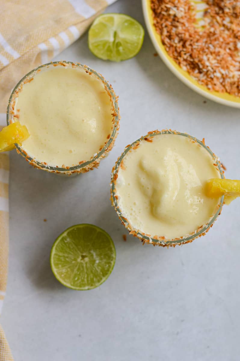 Birds eye view of two pina colada mocktails.