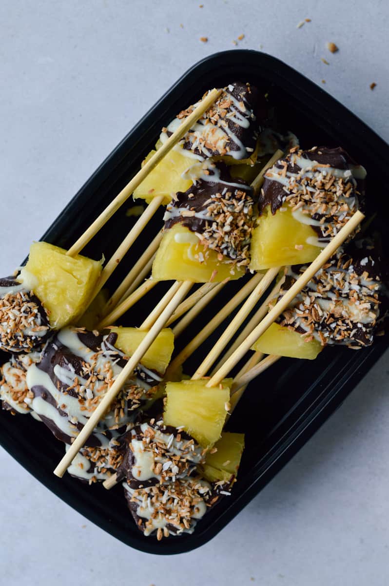 Box of chocolate covered pineapples to be stored in the freezer.