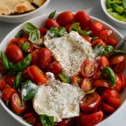 Burrata caprese salad served with pita.