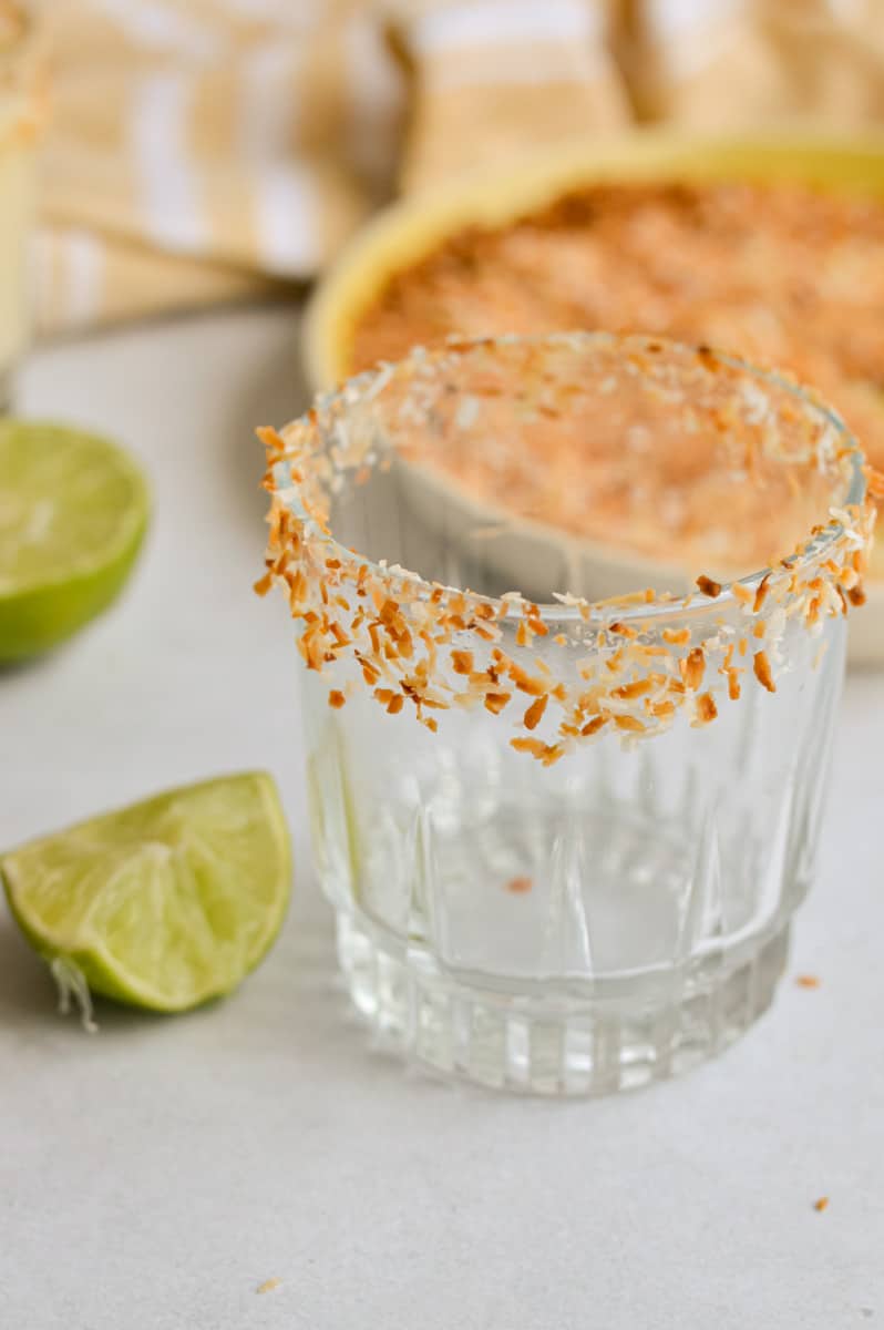Cocktail glass with toasted coconut rim.