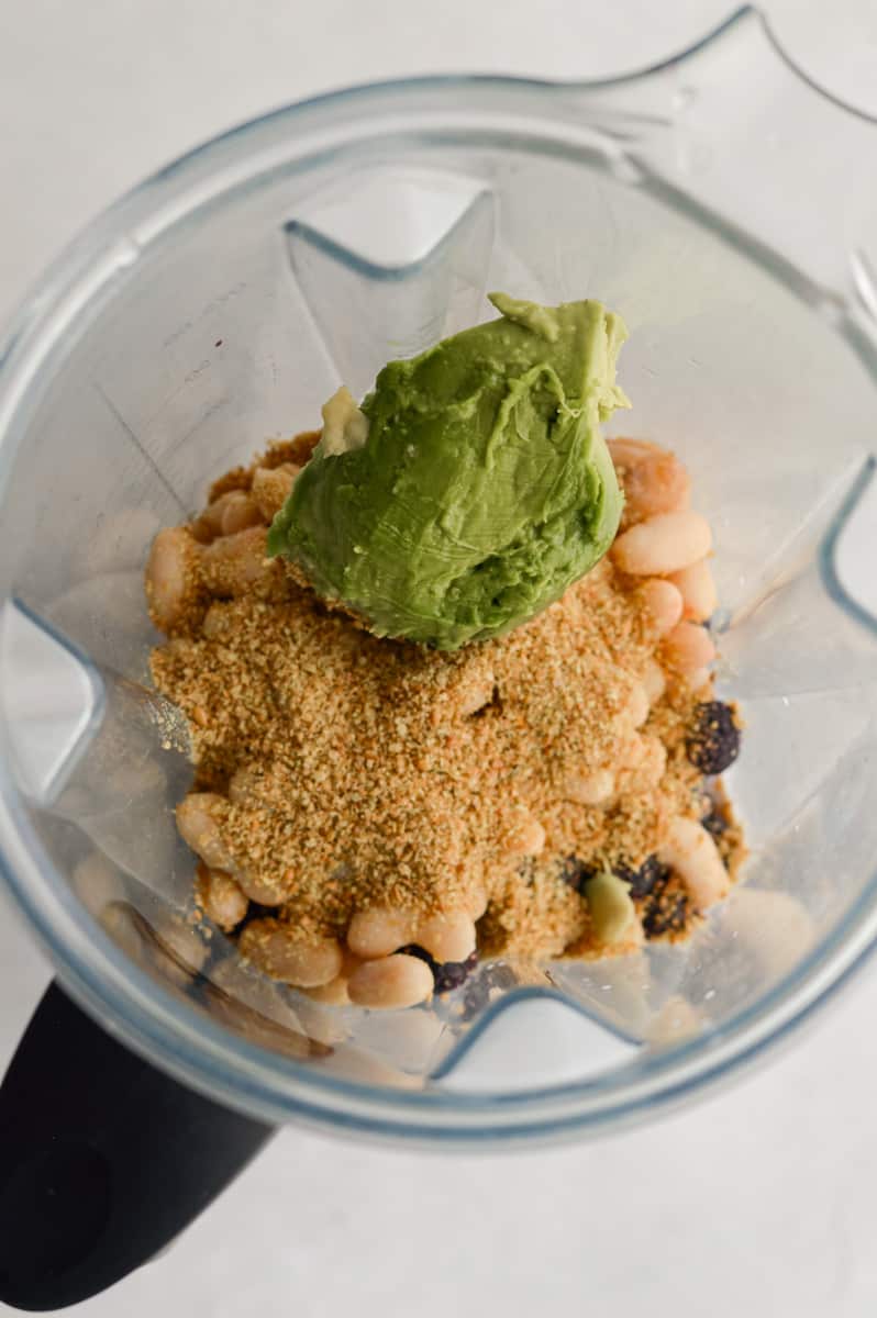 Adding ingredients to a blender.