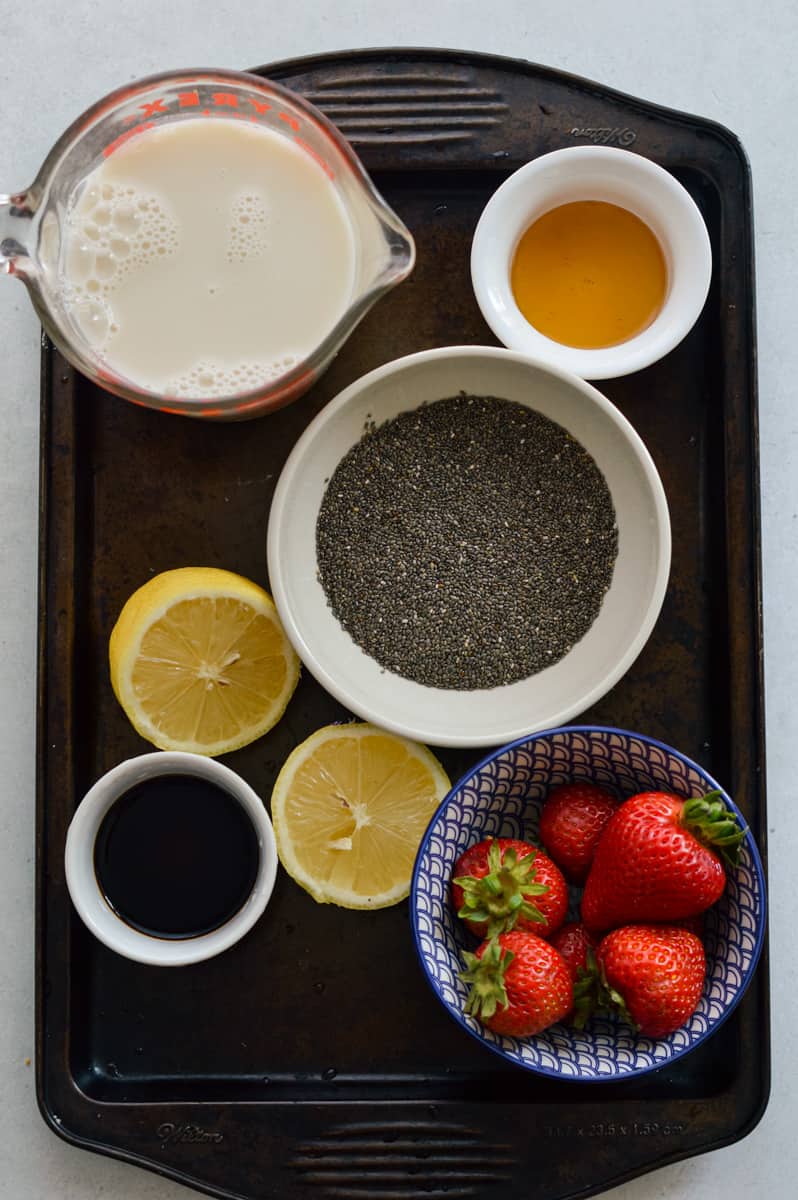 Ingredients including milk, chia seeds, lemon, honey, maple syrup and vanilla extract.