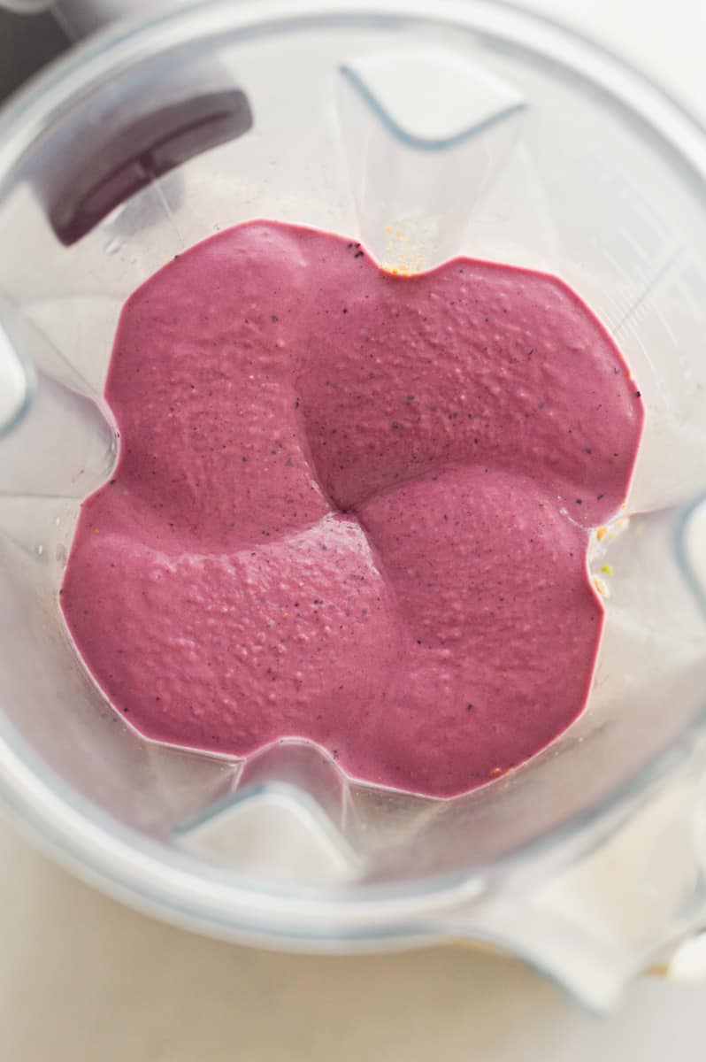 Blending berry high fiber smoothie.