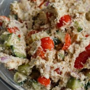 Close up of greek chicken tzatziki salad in a bowl.