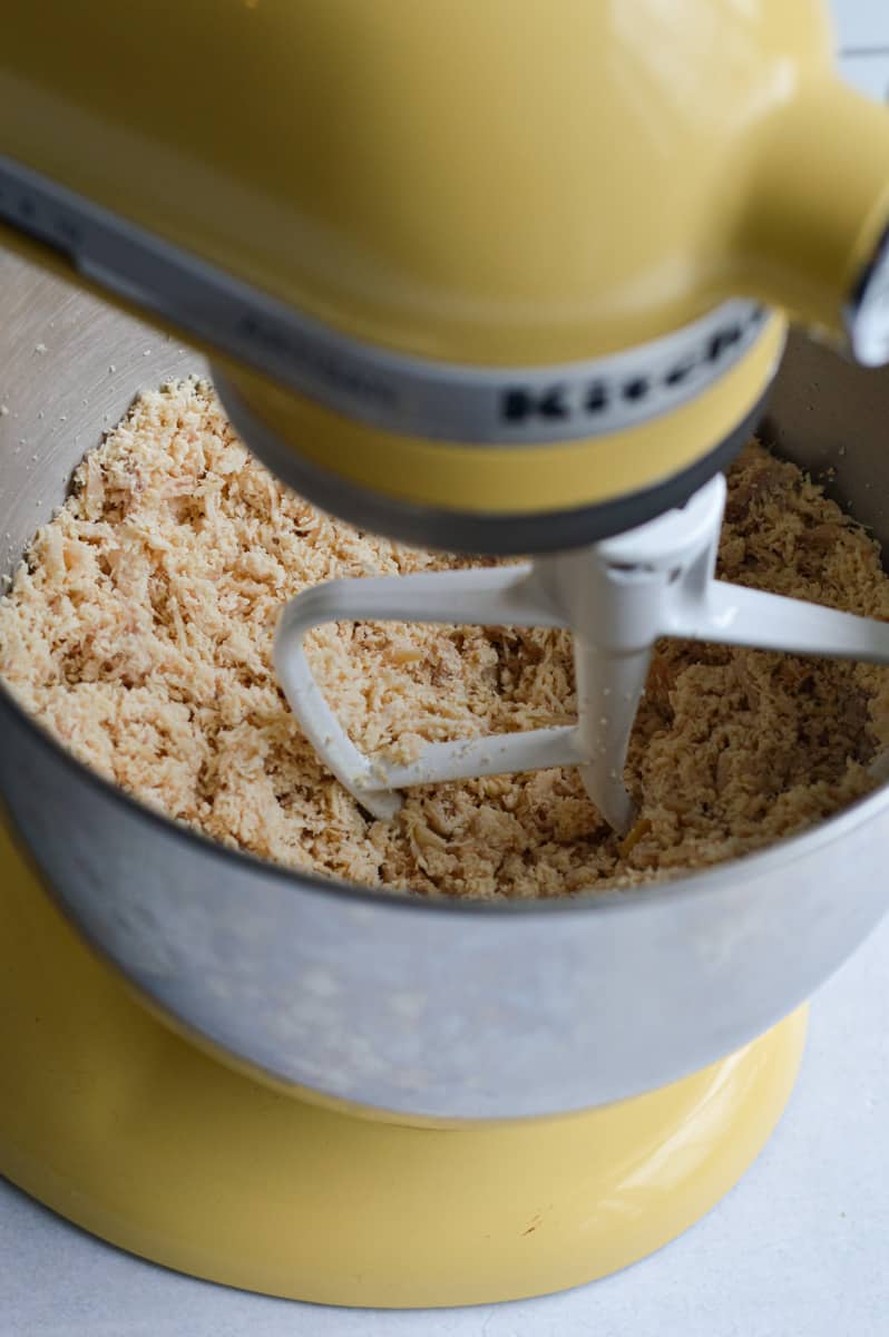 Shredding chicken in a stand mixer.