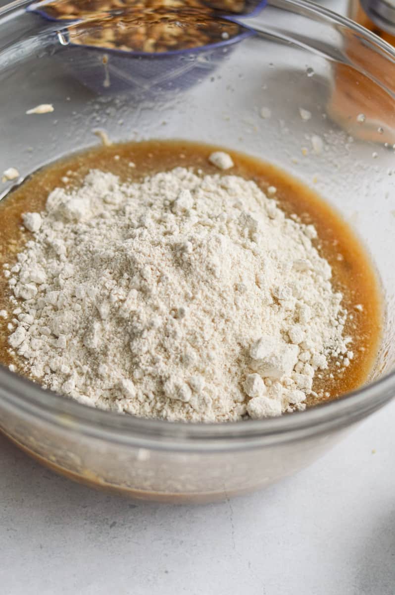 Mixing oat flour into muffin batter.