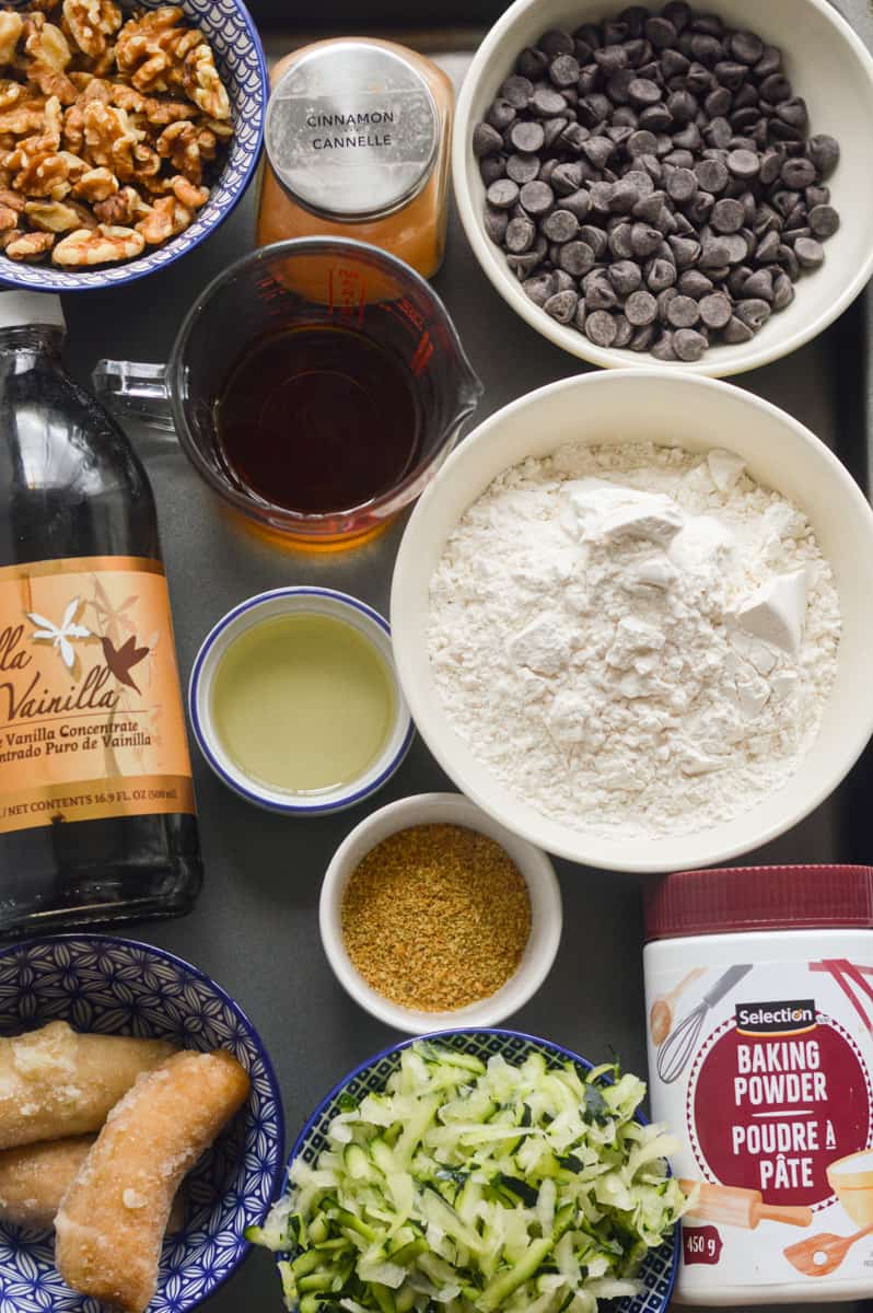 Ingredients including oat flour, zucchini, flax egg, maple syrup, olive oil, bananas and more.