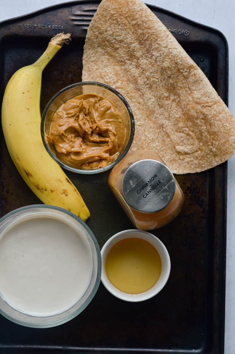 Ingredients including peanut butter, hemp seeds, Greek yogurt, honey, banana, tortilla.