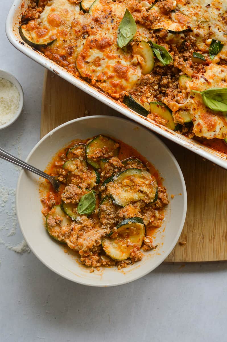 Serving a bowl of ground beef zucchini casserole.