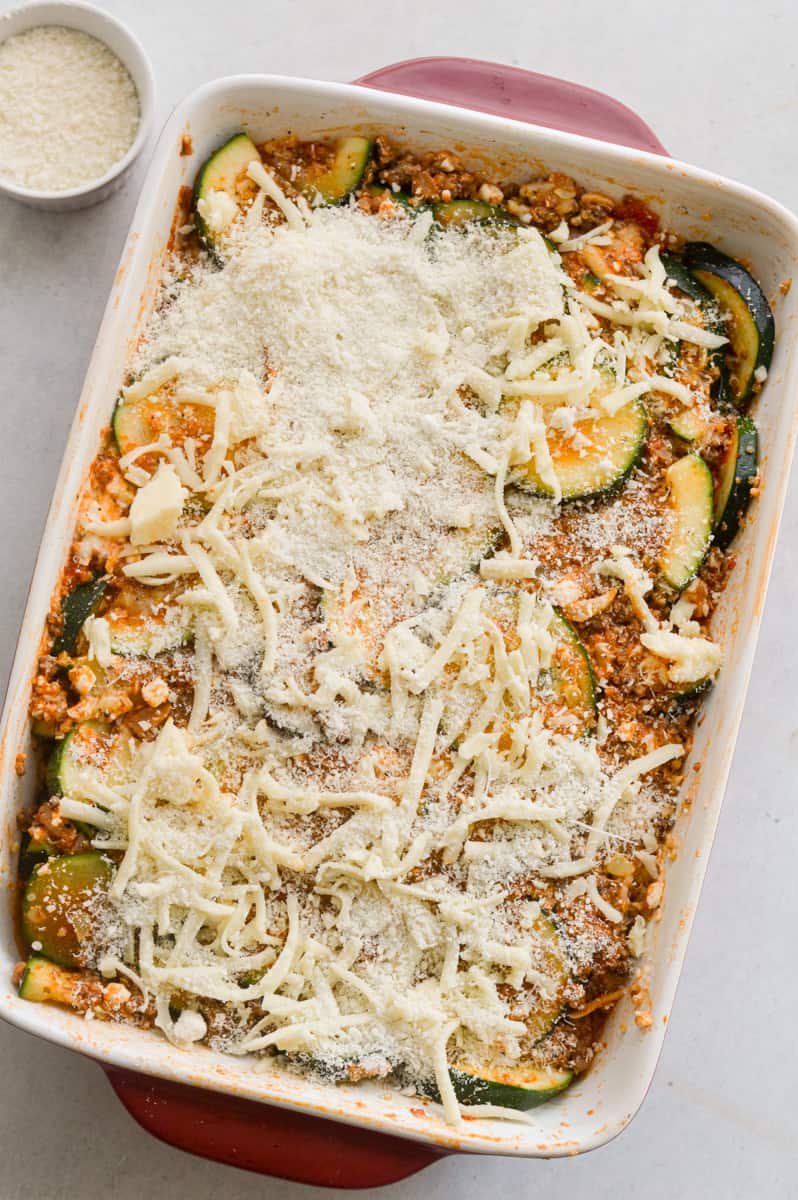 Topping casserole with mozzarella cheese.