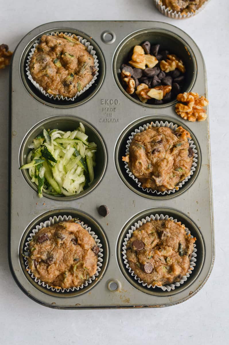 Muffin tin with vegan zucchini muffins.