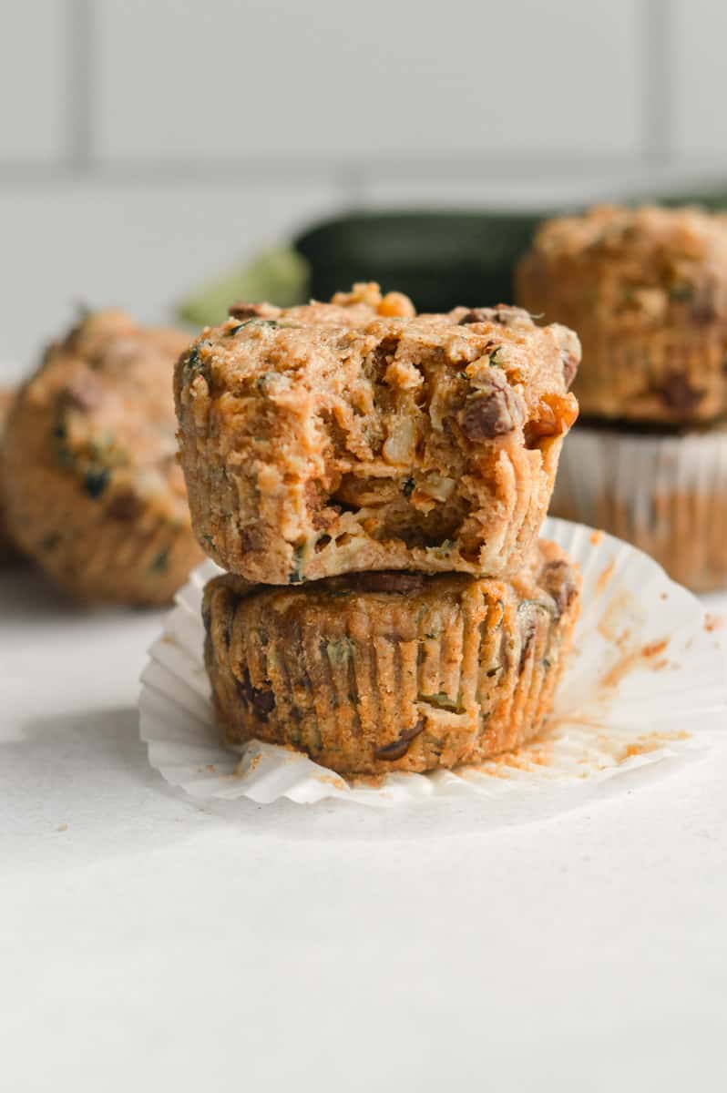 Vegan zucchini muffin with a bite.