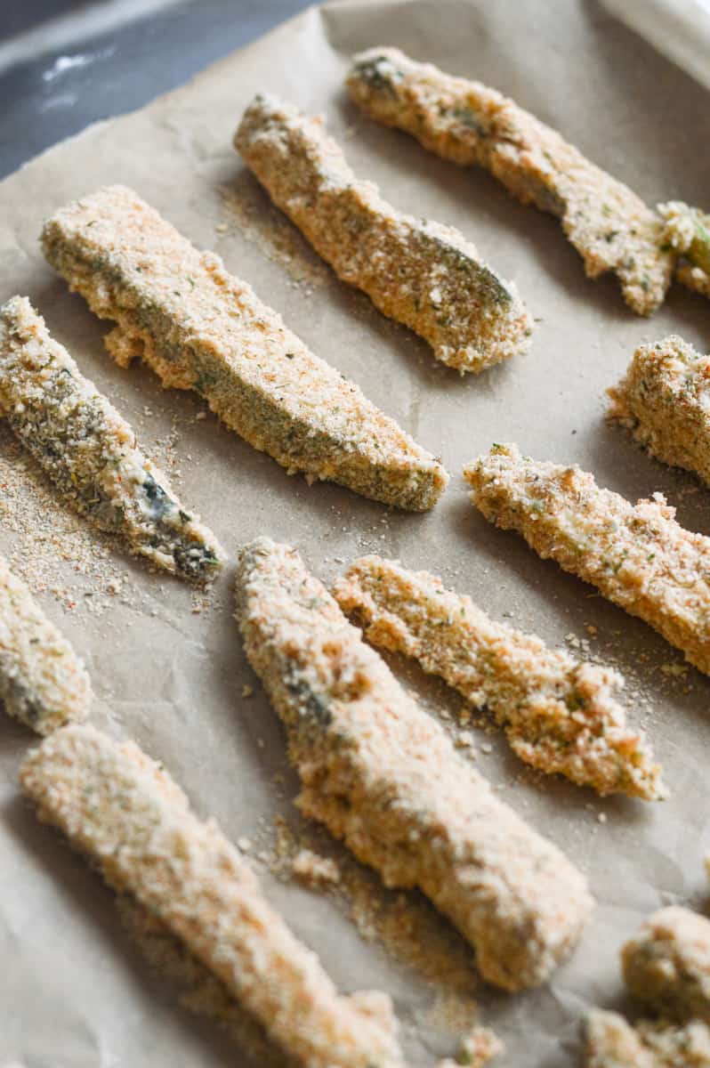 Crispy zucchini fries on a tray.