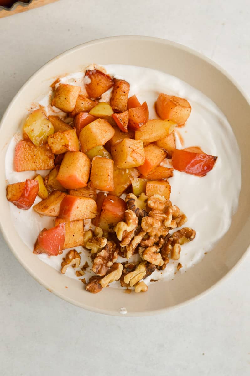 Yogurt with granola and air fryer apples.