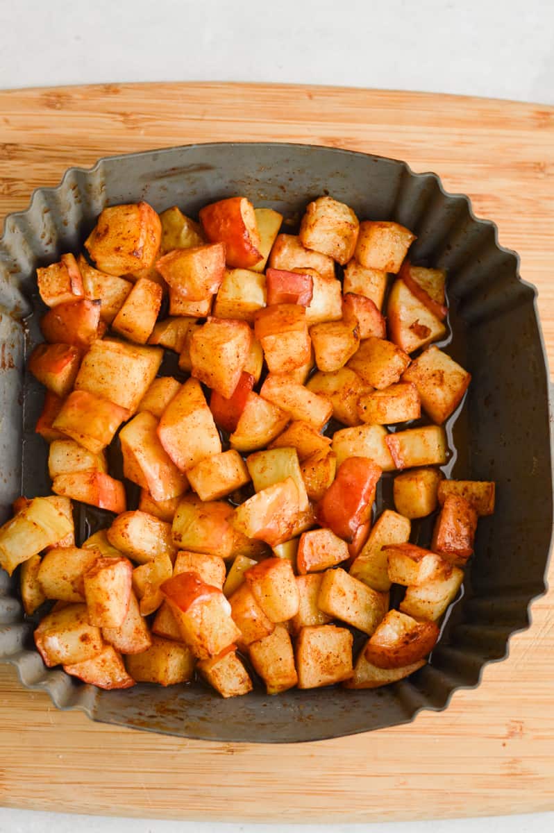 Baked apples in air fryer basket.