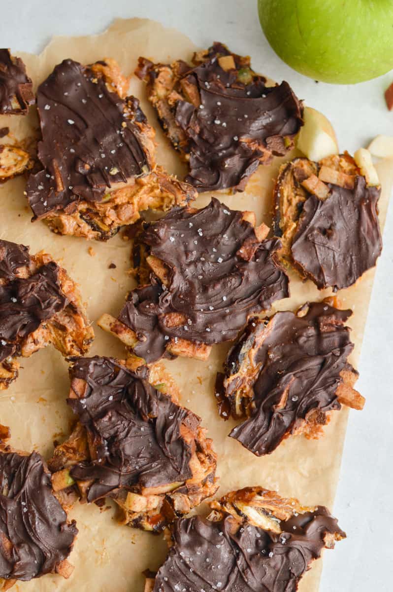 Breaking chocolate date bark into even pieces.