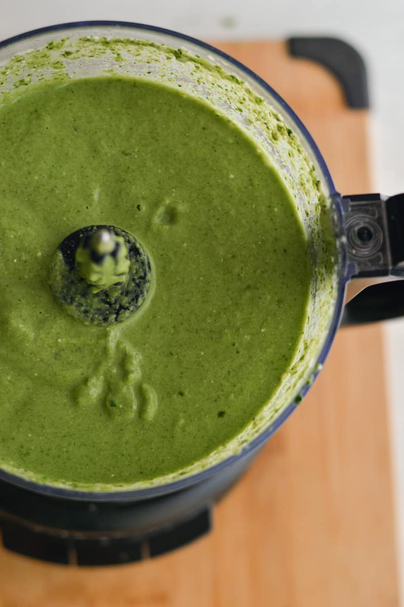 Blending ingredients for green pasta sauce.