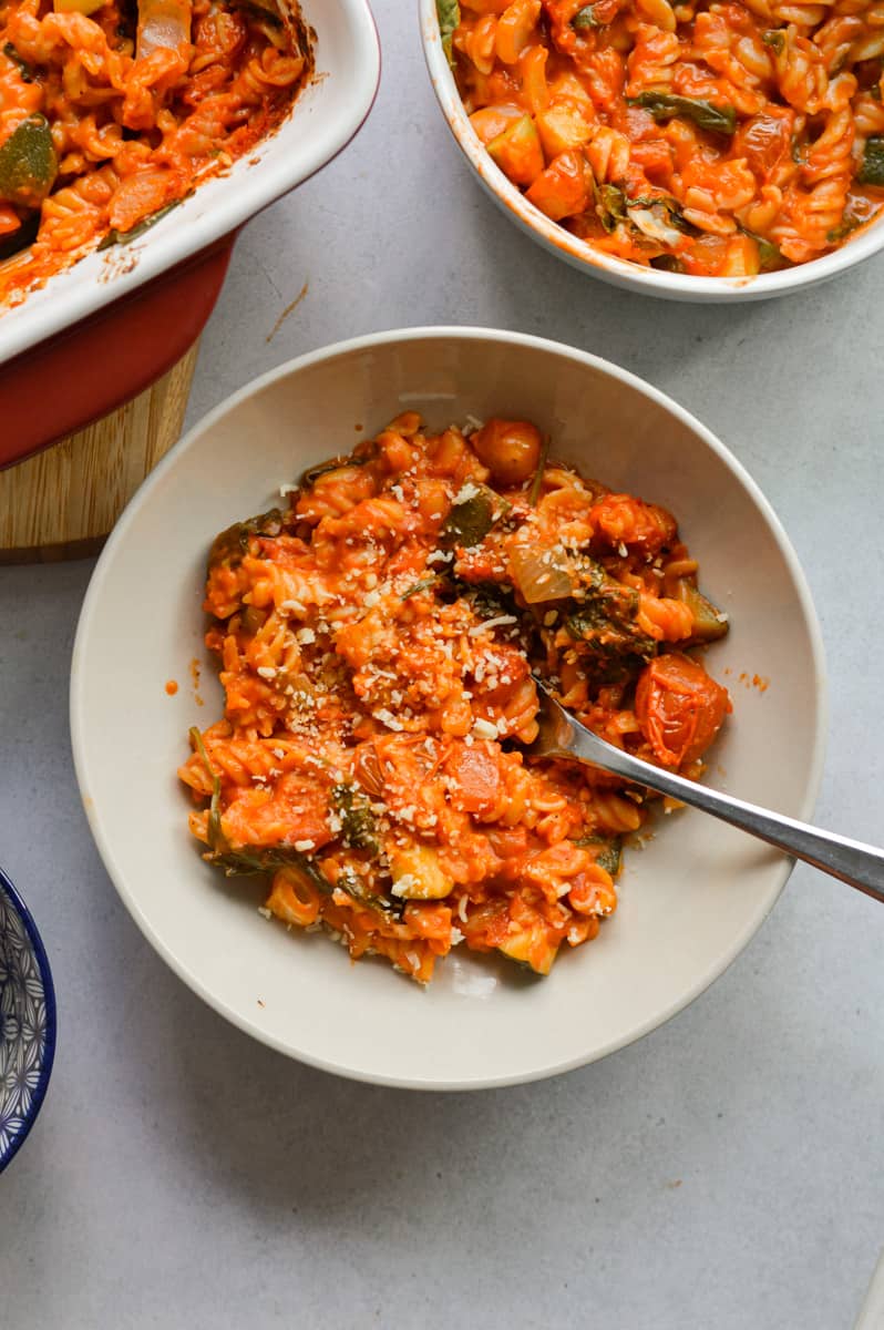 Serving bowls of vegan pasta bake.